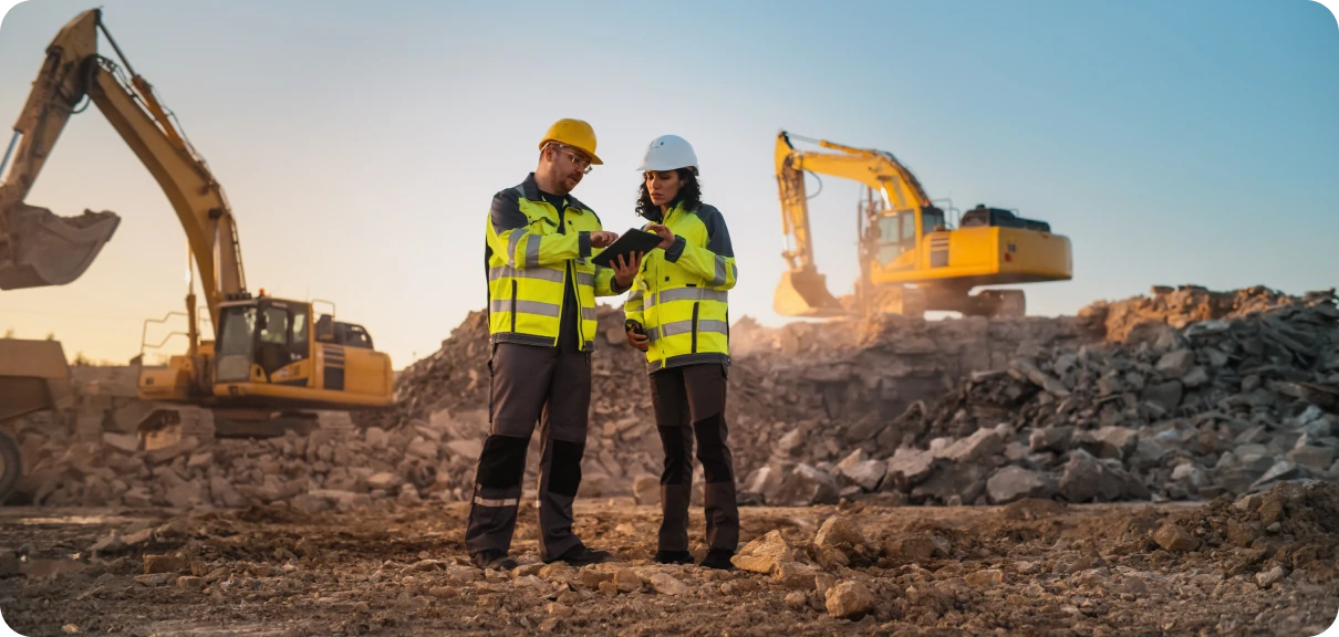 Engineers reviewing plans at construction site