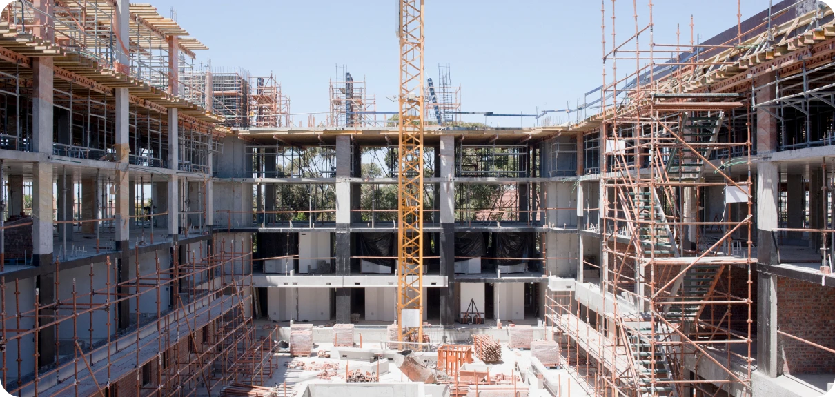 Construction site with scaffolding and crane