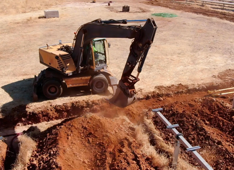 Excavator digging in dry soil